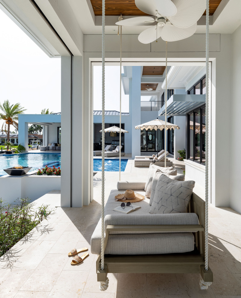Inspiration for a huge backyard stone and rectangular infinity and privacy pool remodel