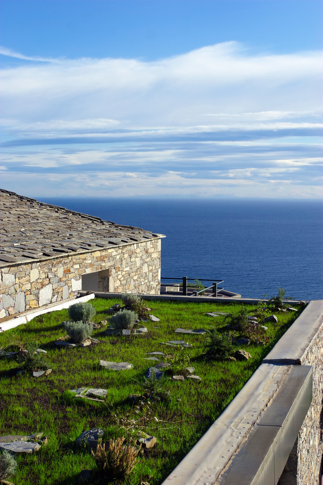 Mid-sized mediterranean rooftop garden in Corsica.
