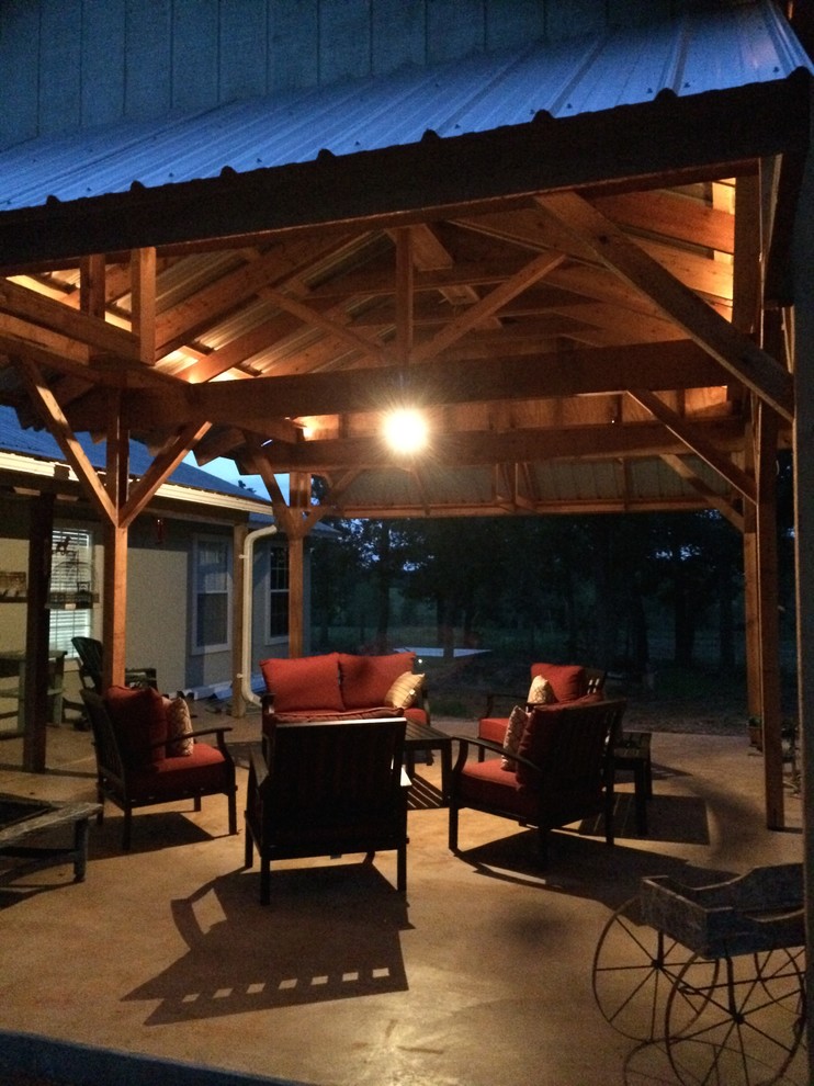 Photo of a large country front yard patio in Austin with a gazebo/cabana.