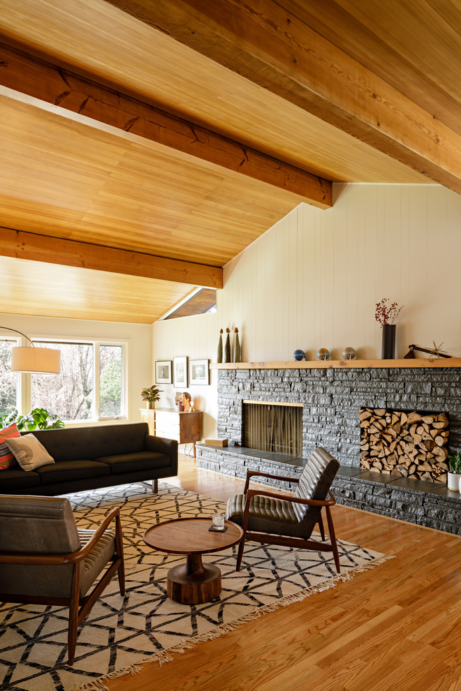 Midcentury formal living room in Portland with beige walls, medium hardwood floors and a ribbon fireplace.