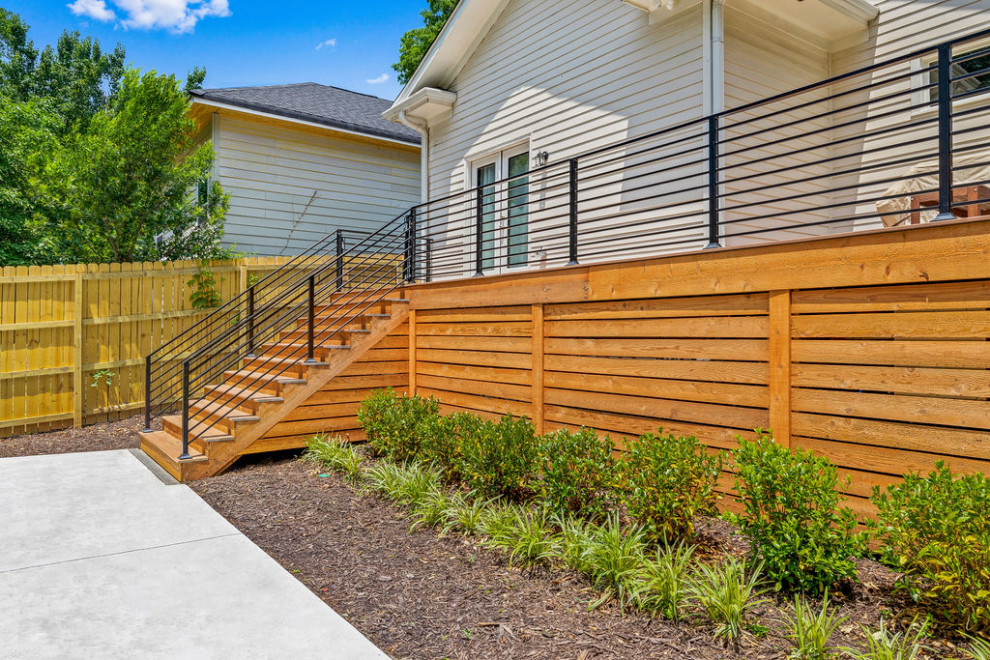 Inspiration for a medium sized contemporary back ground level metal railing terrace in Atlanta with skirting and no cover.