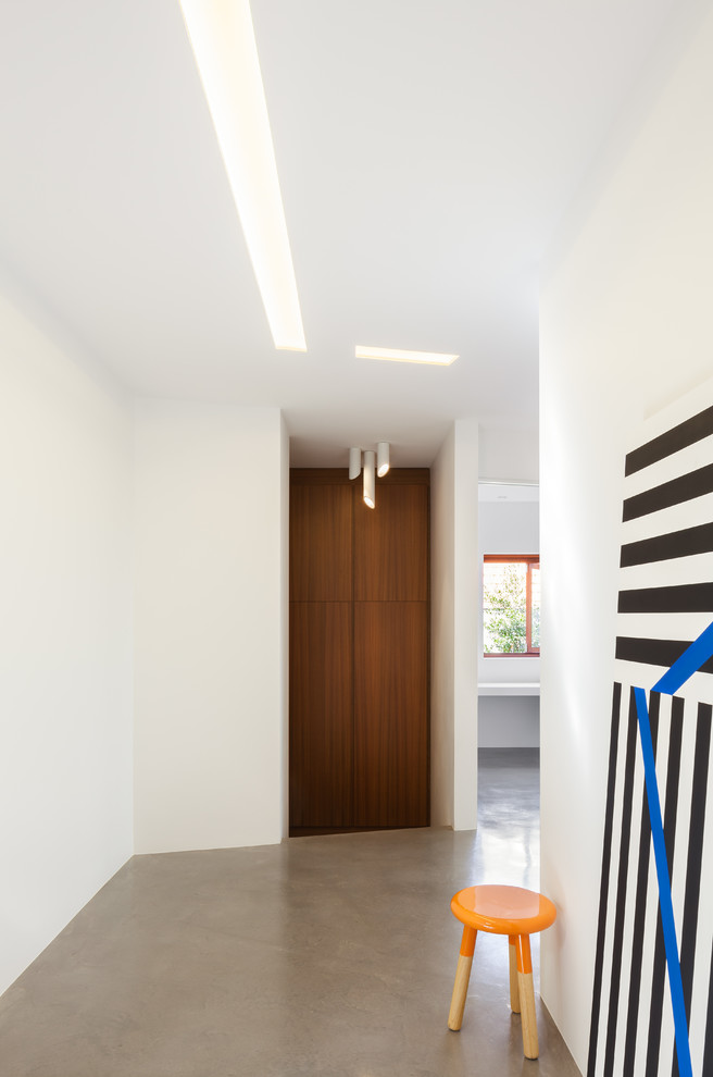 Design ideas for a contemporary hallway in Sydney with white walls and concrete floors.