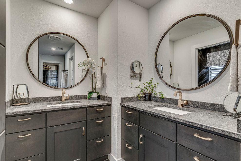 This is an example of a modern master wet room bathroom in Dallas with shaker cabinets, dark wood cabinets, a single vanity, a freestanding tub, black and white tile, porcelain tile, white walls, porcelain floors, an undermount sink, grey floor, an open shower, multi-coloured benchtops and a built-in vanity.