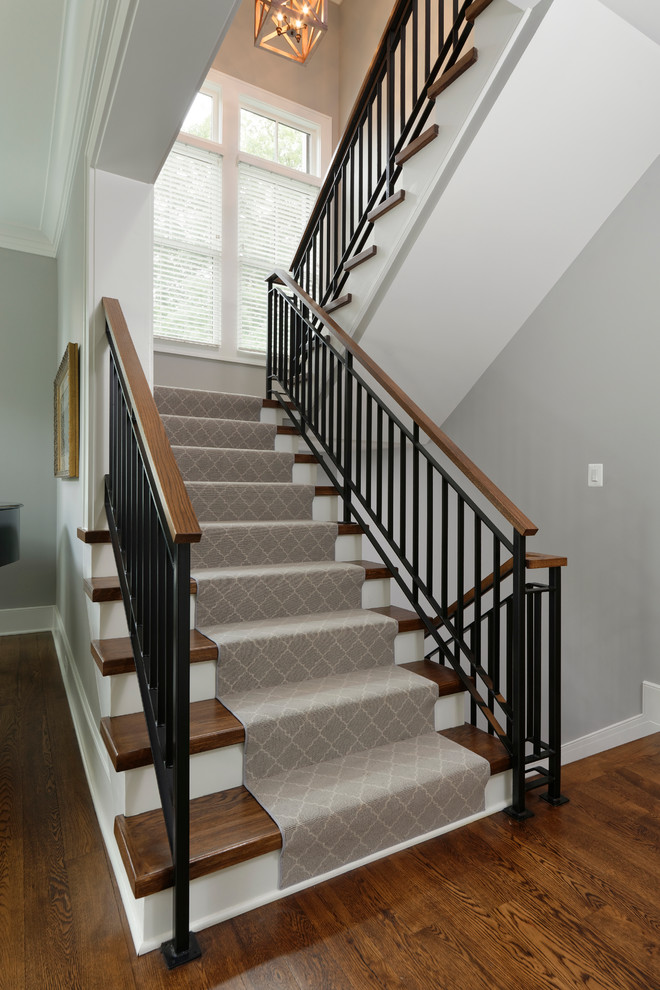 Photo of a mid-sized transitional wood staircase in DC Metro with painted wood risers.