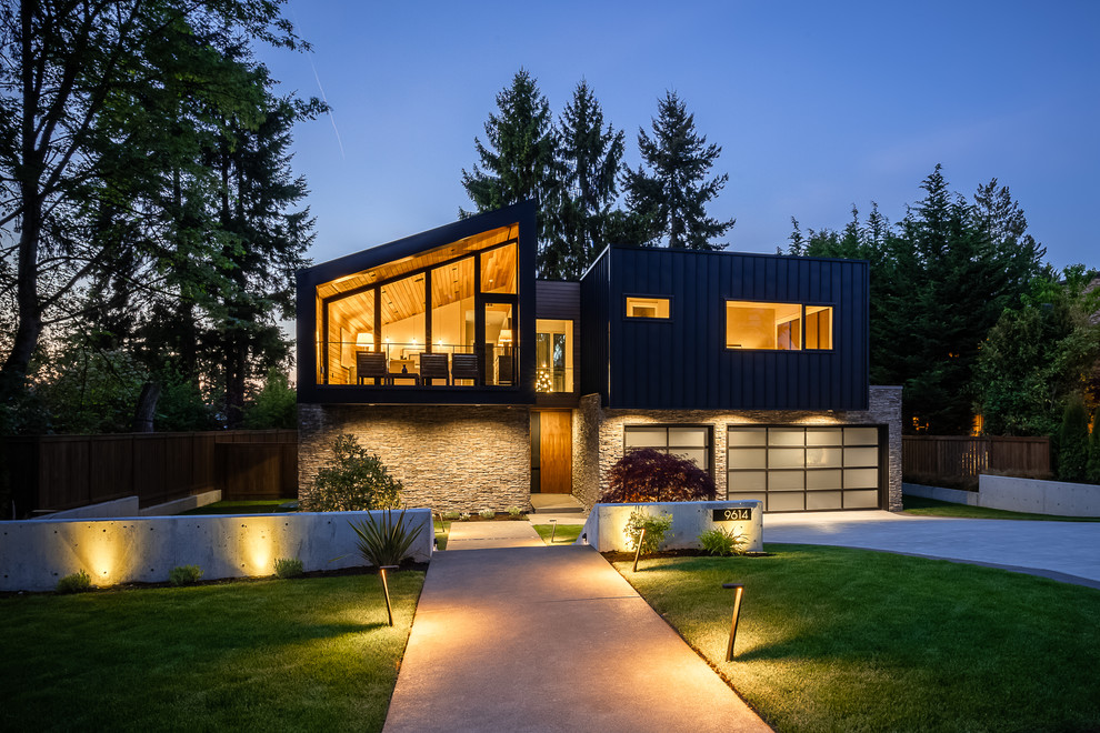 Contemporary black house exterior in Seattle with metal siding and a flat roof.