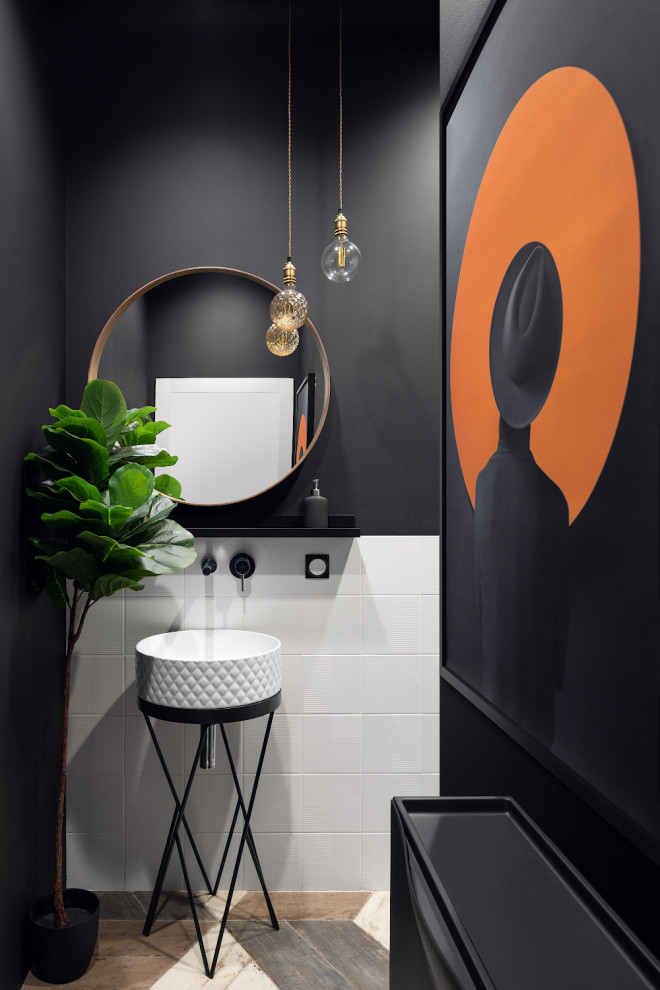 Photo of a mid-sized contemporary powder room in Moscow with furniture-like cabinets, white tile, porcelain tile, black walls, a vessel sink, beige floor and a freestanding vanity.