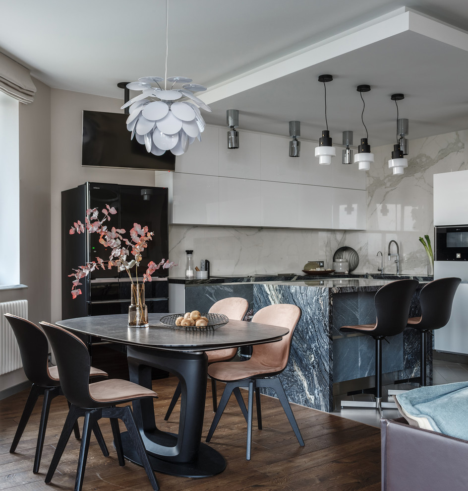 This is an example of a contemporary open plan dining in Moscow with dark hardwood floors, brown floor, beige walls and no fireplace.