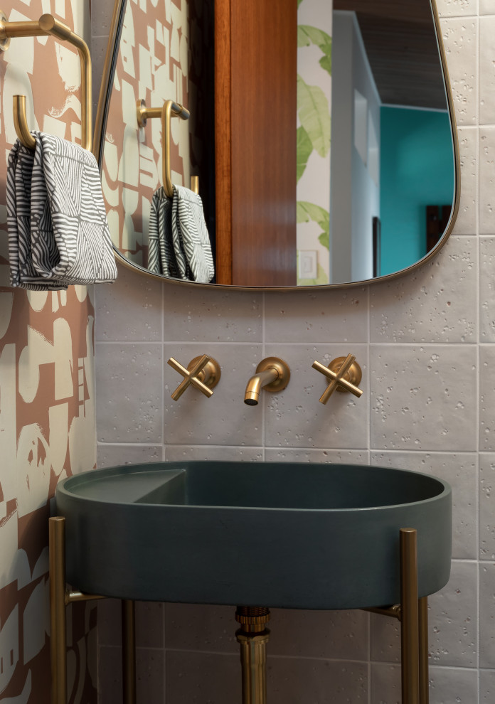 Design ideas for a small midcentury cloakroom in Seattle with flat-panel cabinets, black cabinets, a one-piece toilet, porcelain tiles, beige walls, concrete flooring, a console sink, beige floors, a vaulted ceiling and wallpapered walls.