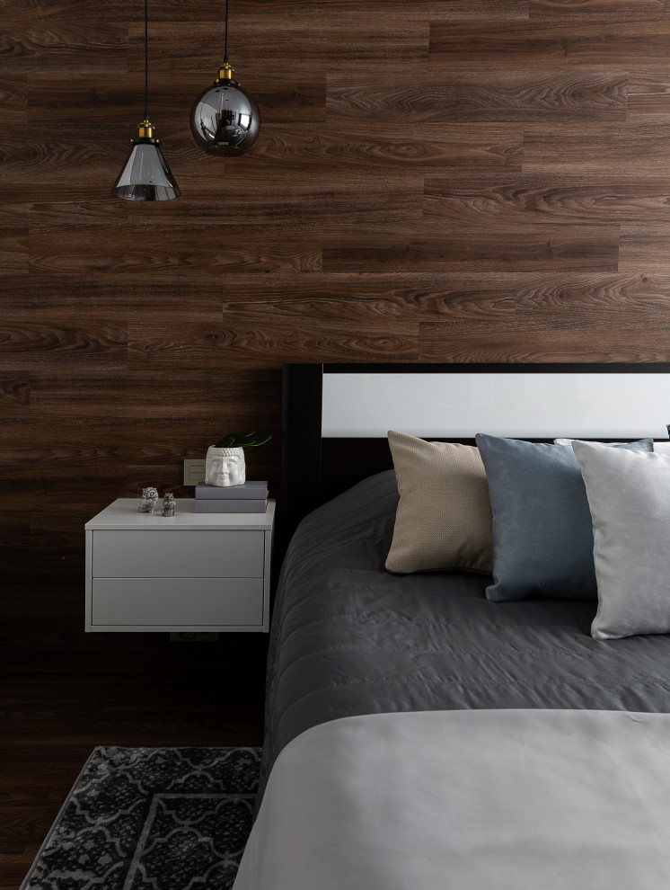 Exemple d'une chambre parentale blanche et bois tendance de taille moyenne avec un mur gris, un sol en vinyl, un sol marron et boiseries.