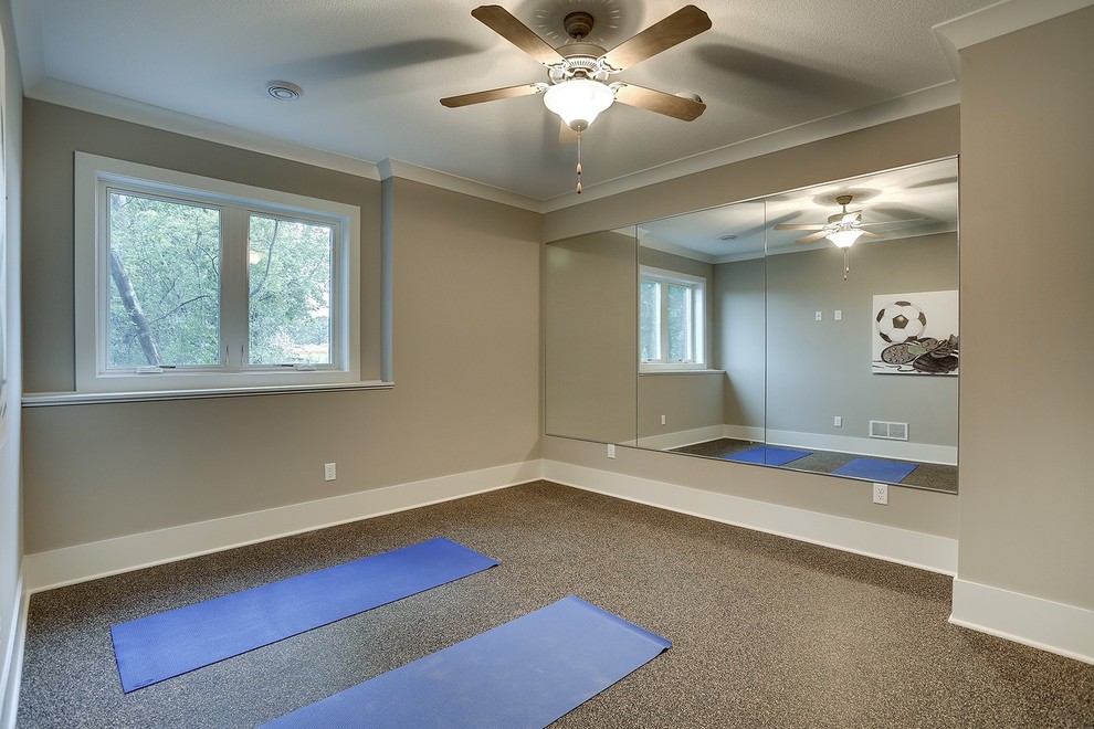Large transitional home yoga studio in Minneapolis with grey walls and cork floors.