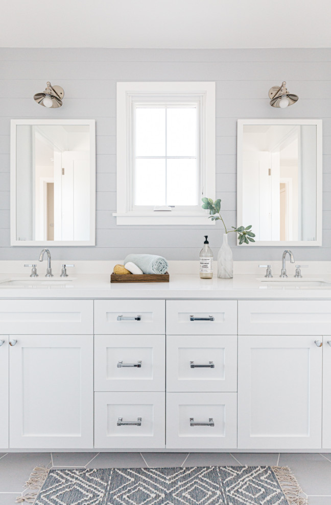 This is an example of a country bathroom in Los Angeles with shaker cabinets, white cabinets, grey walls, an undermount sink, grey floor, white benchtops and a double vanity.