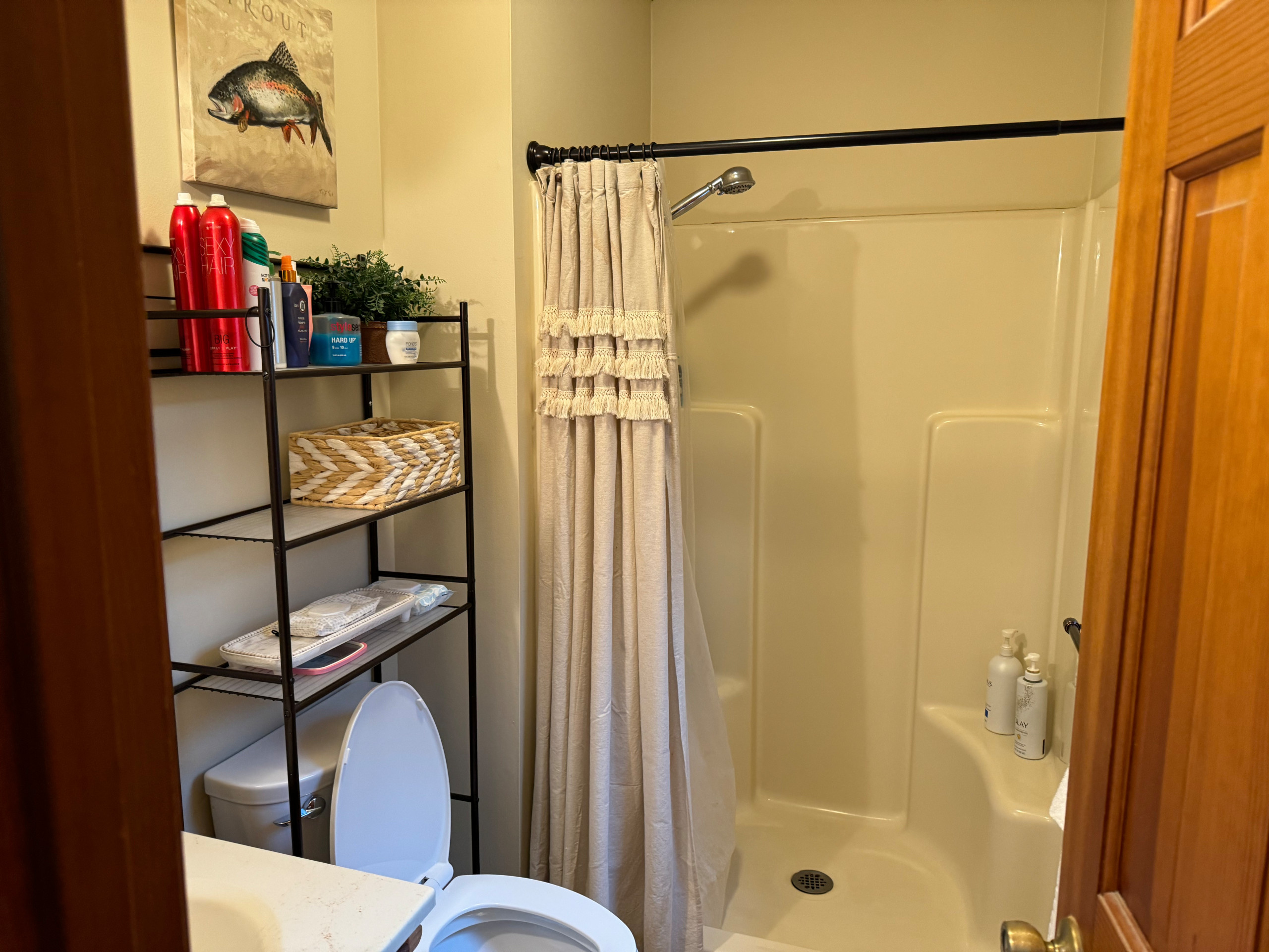 Rustic Farmhouse Bathroom Remodel with Wood-Look Tile and Pebble Shower Floor