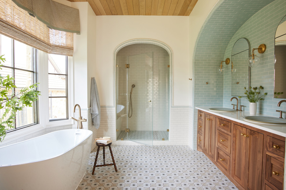 Freestanding bathtub - large transitional master blue tile and ceramic tile ceramic tile, double-sink and wood ceiling freestanding bathtub idea in Dallas with beaded inset cabinets, medium tone wood cabinets, a drop-in sink, quartz countertops, a hinged shower door, white countertops and a built-in vanity