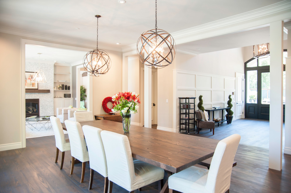 Photo of a large contemporary separate dining room in San Francisco with beige walls and dark hardwood floors.