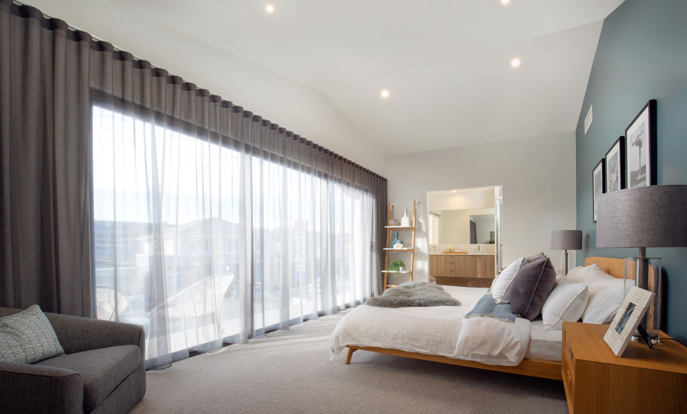 Design ideas for a large scandinavian master bedroom in Brisbane with white walls, ceramic floors, white floor and vaulted.