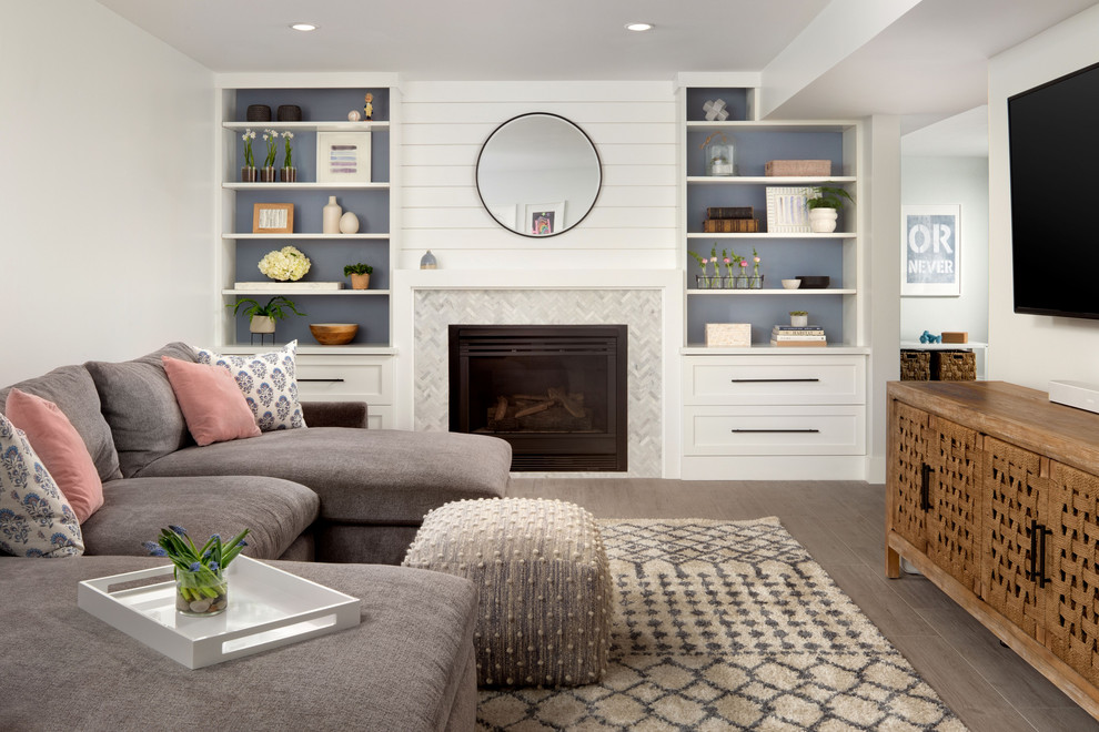 Design ideas for a transitional family room in DC Metro with white walls, a standard fireplace, a tile fireplace surround, brown floor and planked wall panelling.