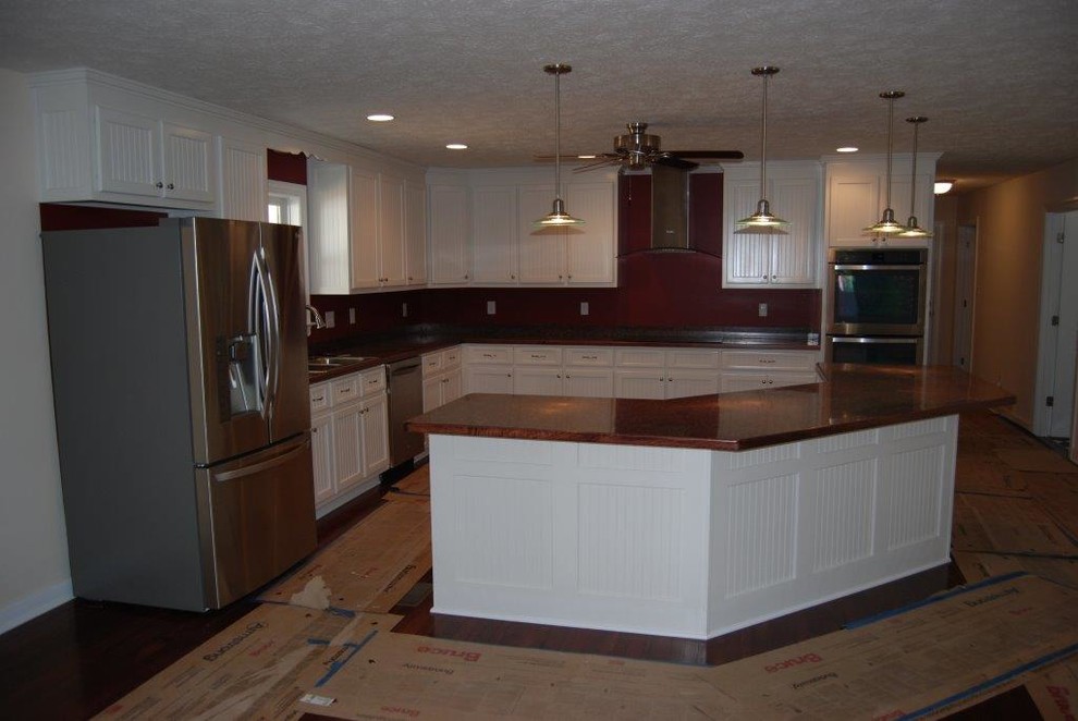 Mid-sized l-shaped dark wood floor open concept kitchen photo in Richmond with a double-bowl sink, white cabinets, multicolored backsplash, stainless steel appliances and an island