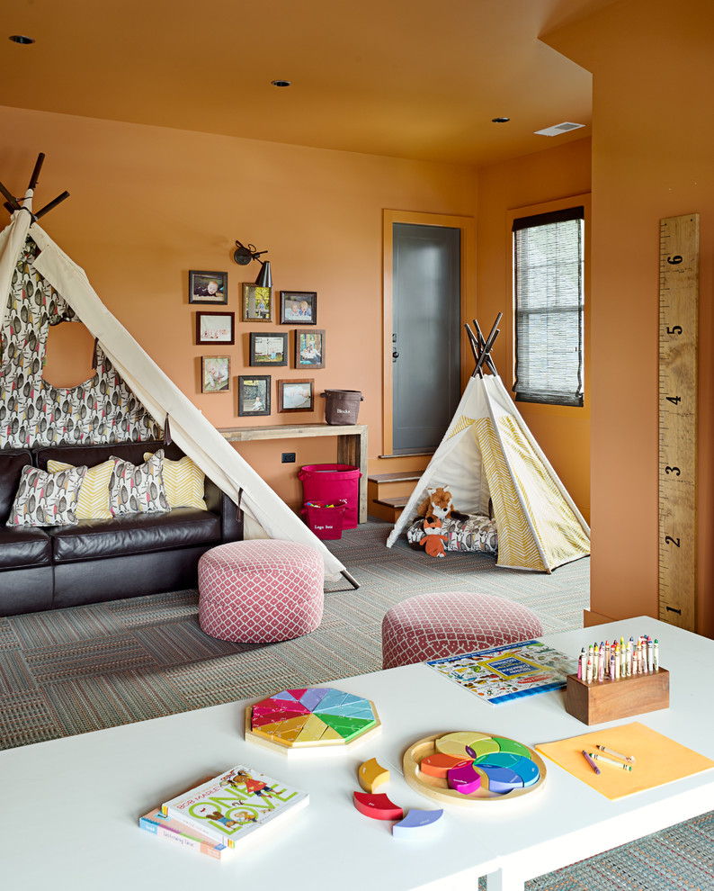 Mid-sized transitional gender-neutral carpeted kids' room photo in Other with orange walls