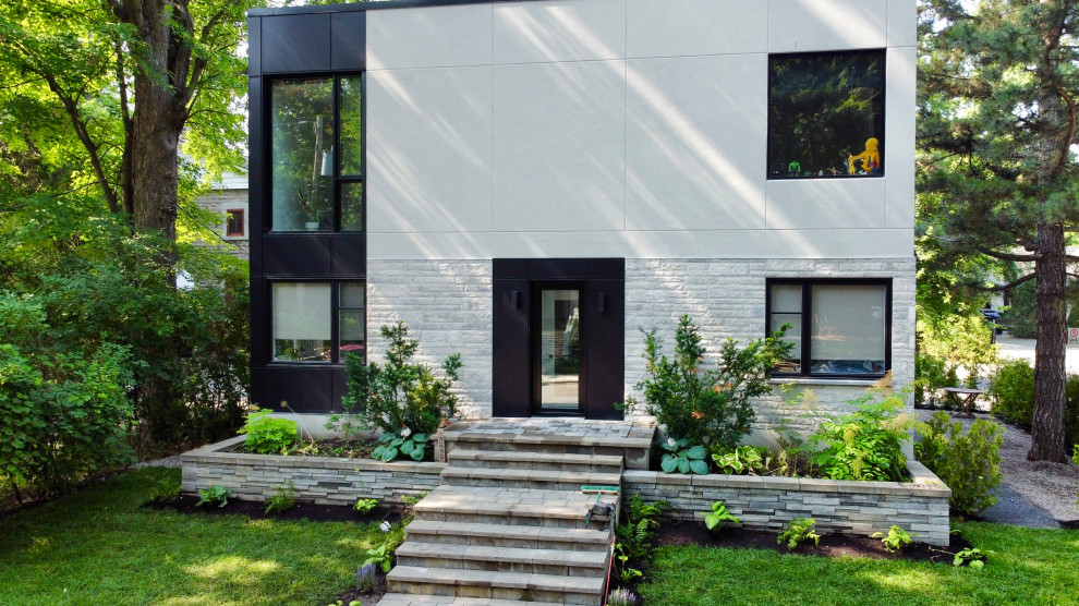 Design ideas for a modern house exterior in Montreal.