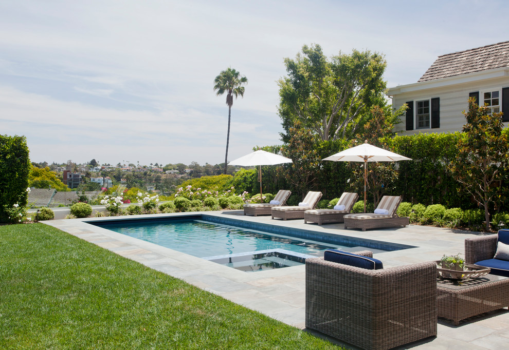 Mid-sized traditional backyard rectangular lap pool in Los Angeles with a hot tub and tile.