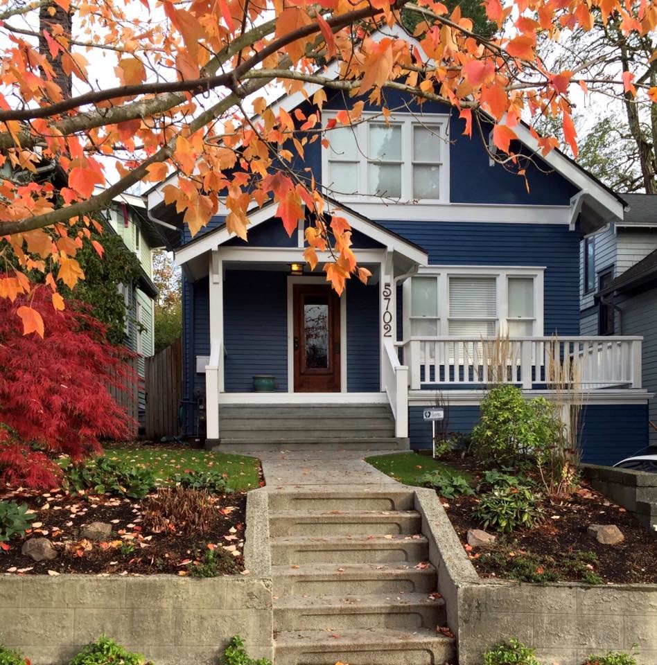This is an example of a mid-sized arts and crafts two-storey blue exterior in Seattle.