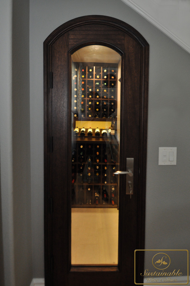 Design ideas for a small modern wine cellar in San Diego with porcelain floors and storage racks.