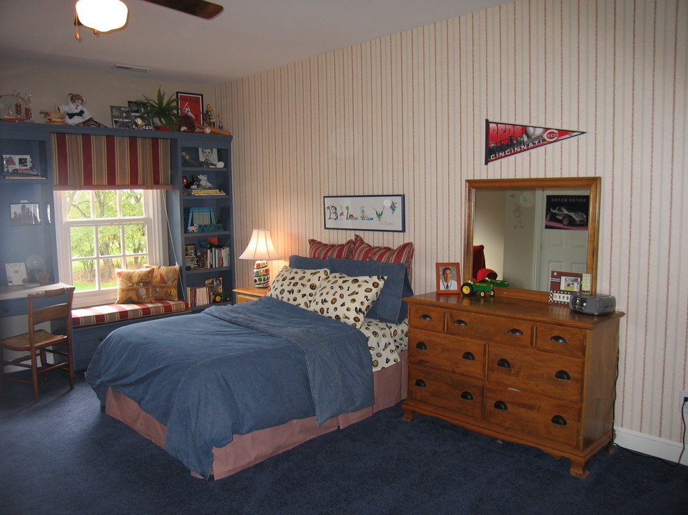 Design ideas for a large transitional bedroom in Columbus with beige walls and carpet.