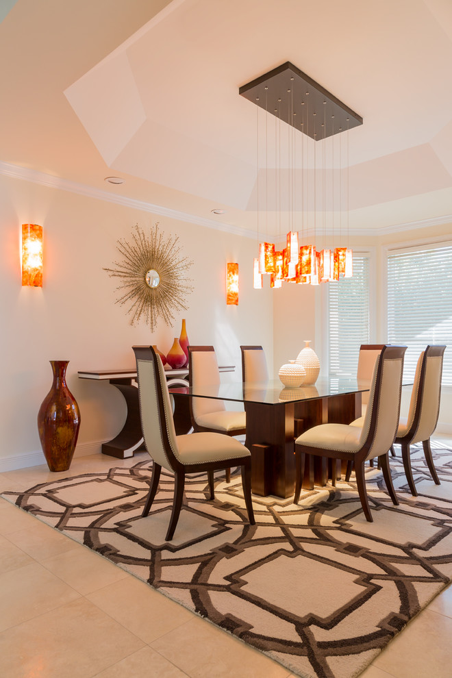 Contemporary dining room in New York with beige walls and porcelain floors.