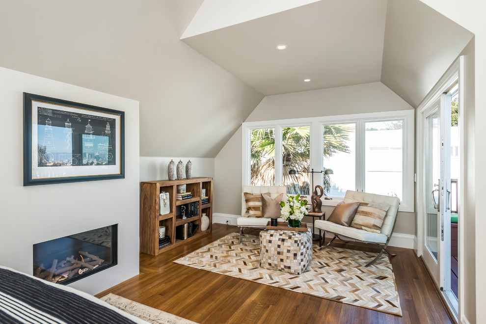 Example of a small transitional open concept medium tone wood floor living room design in San Francisco with a ribbon fireplace and no tv