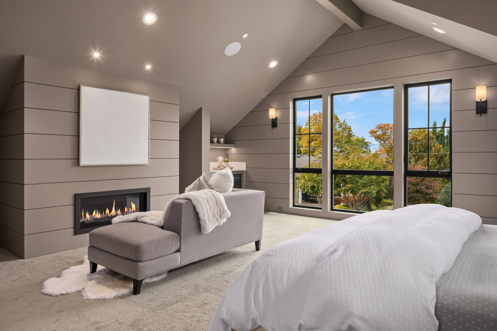 Design ideas for an expansive country master bedroom in Seattle with grey walls, carpet, a standard fireplace, vaulted and planked wall panelling.