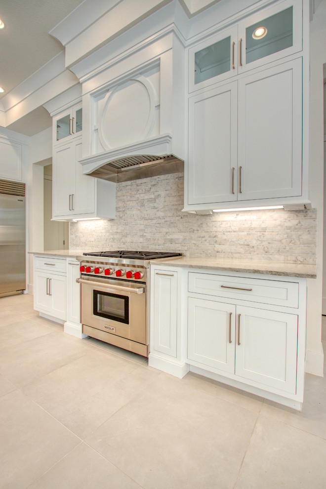 Example of a transitional home design design in Miami