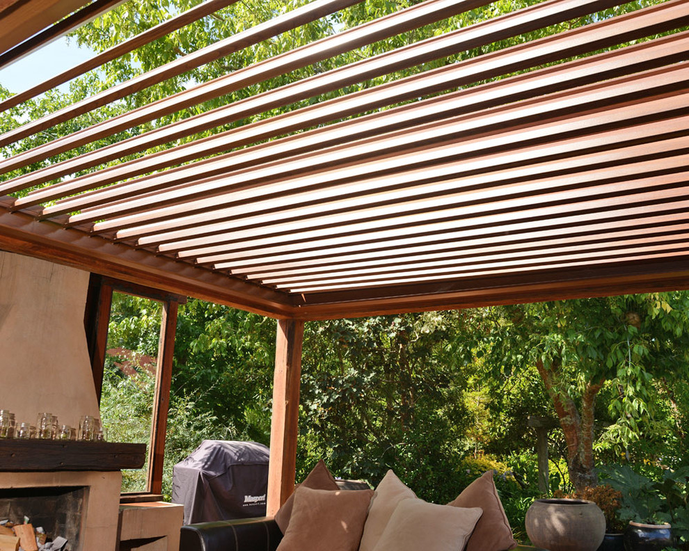 Design ideas for a contemporary backyard patio in Sydney with a roof extension.