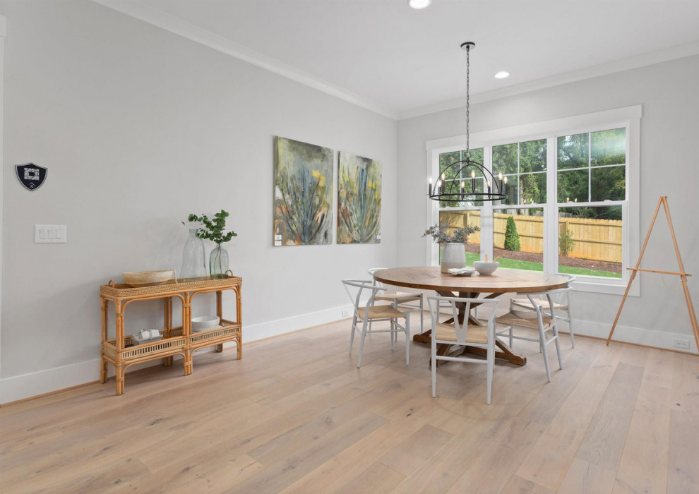 Inspiration for a mid-sized modern dining room in Los Angeles with light hardwood floors, multi-coloured floor, vaulted, white walls, no fireplace, a brick fireplace surround and planked wall panelling.