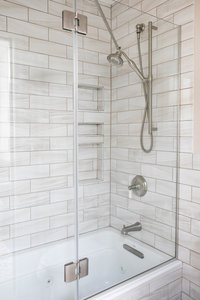 Inspiration for a mid-sized transitional master bathroom in Other with flat-panel cabinets, white cabinets, a drop-in tub, a shower/bathtub combo, beige walls, ceramic floors, an undermount sink, engineered quartz benchtops, a hinged shower door and grey benchtops.