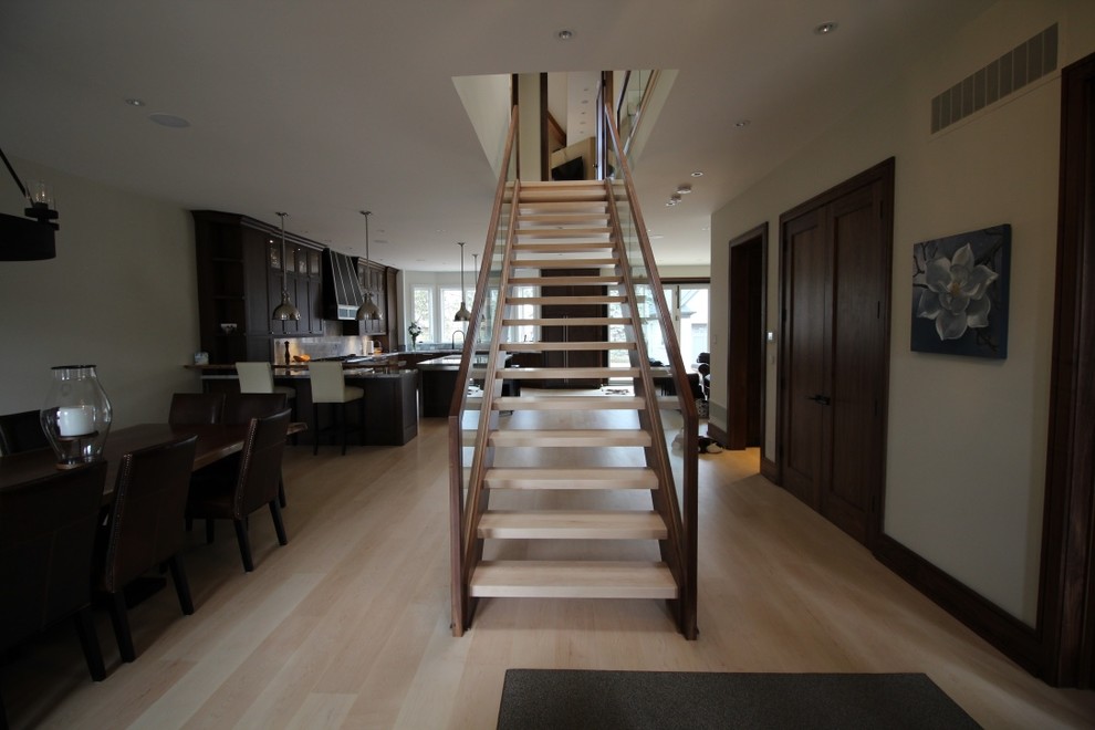 Design ideas for a mid-sized traditional wood straight staircase in Toronto with open risers and wood railing.