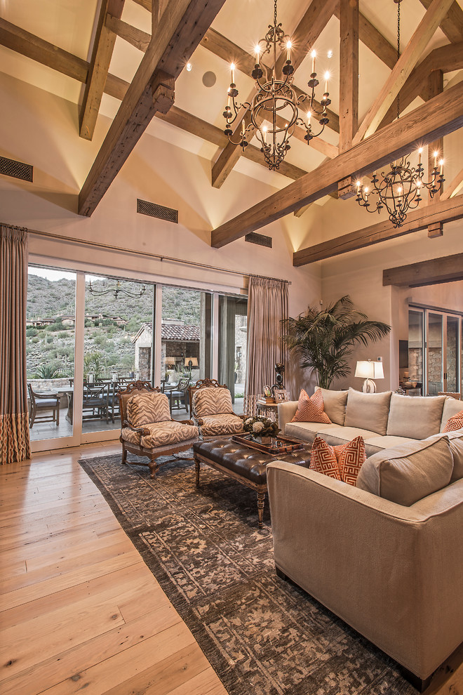 Large transitional formal and enclosed light wood floor living room photo in Phoenix with beige walls, a standard fireplace, a stone fireplace and a wall-mounted tv