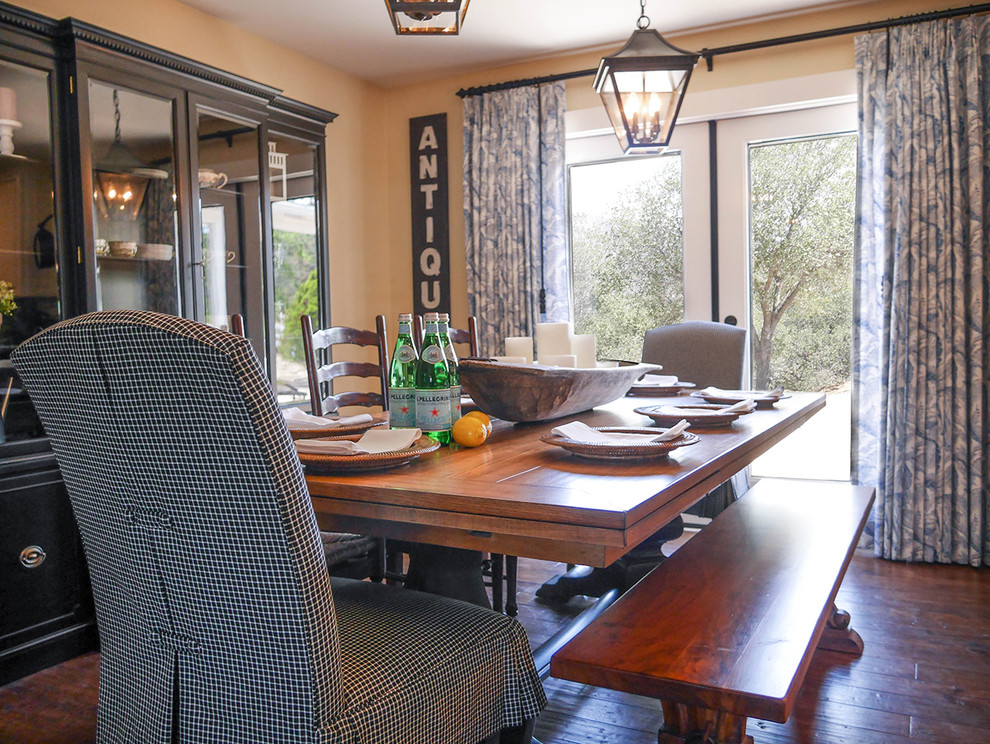This is an example of a country dining room in San Diego with medium hardwood floors.
