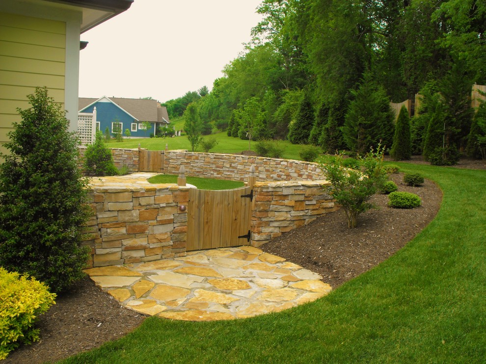 Mid-sized arts and crafts backyard patio in Other with natural stone pavers.