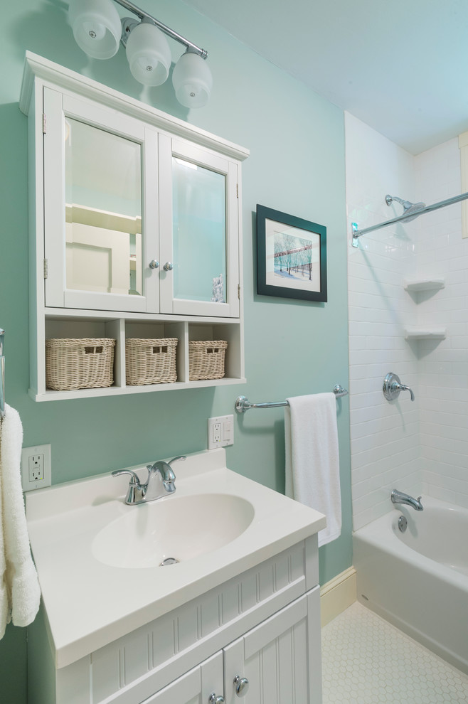 Inspiration for a small transitional bathroom in Boston with beaded inset cabinets, white cabinets, an alcove tub, a corner shower, a two-piece toilet, white tile, ceramic tile, blue walls, ceramic floors and an integrated sink.
