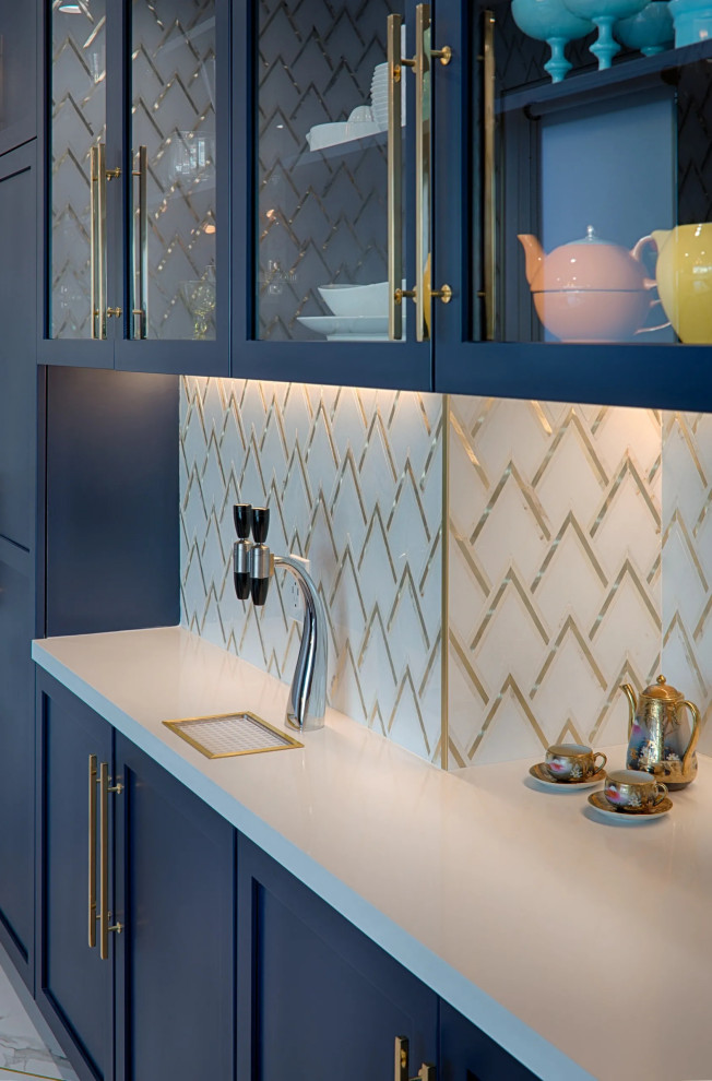 Inspiration for a mid-sized transitional u-shaped kitchen in San Francisco with an undermount sink, shaker cabinets, blue cabinets, quartz benchtops, metallic splashback, marble splashback, stainless steel appliances, porcelain floors, with island, white floor and white benchtop.