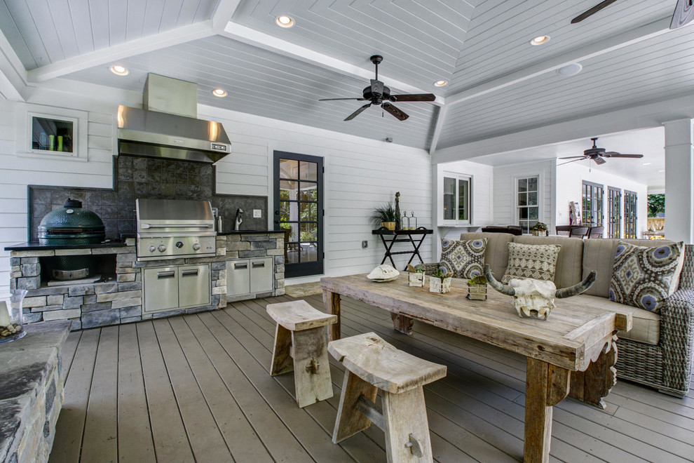 Inspiration for a large country backyard verandah in Tampa with an outdoor kitchen, decking and a roof extension.
