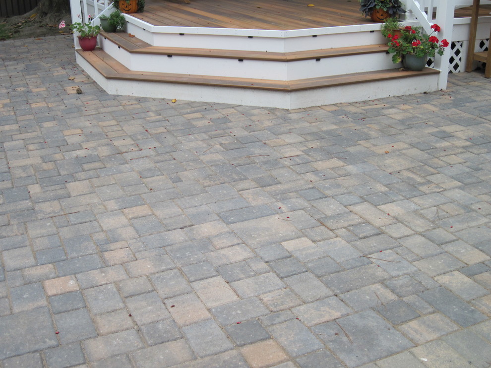 Example of a mid-sized transitional backyard deck design with decking and a pergola