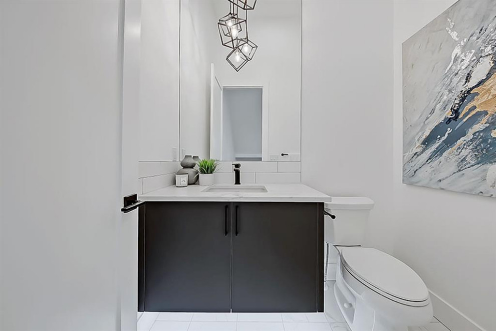 Example of a transitional home design design in Calgary