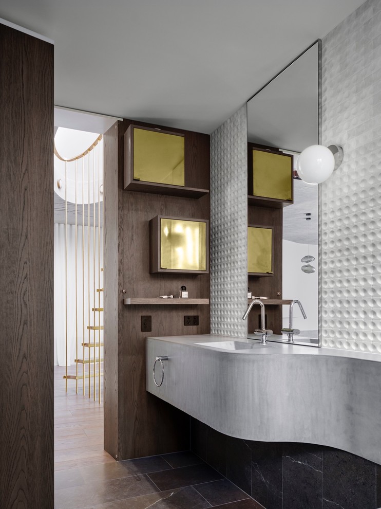 This is an example of a contemporary bathroom in Sydney with gray tile, white tile, white walls, an integrated sink, concrete benchtops, grey floor and grey benchtops.