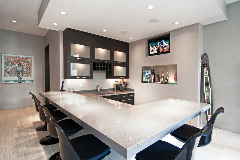 Inspiration for a contemporary u-shaped seated home bar in Minneapolis with an undermount sink, black cabinets, grey benchtop and glass-front cabinets.