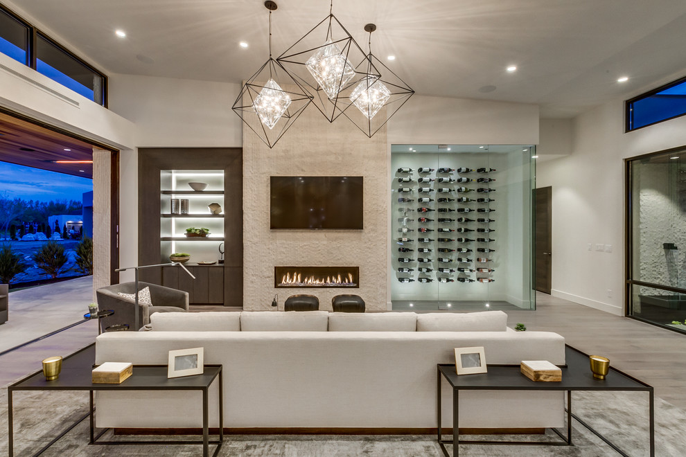 Mid-sized contemporary wine cellar in Boise with light hardwood floors and storage racks.
