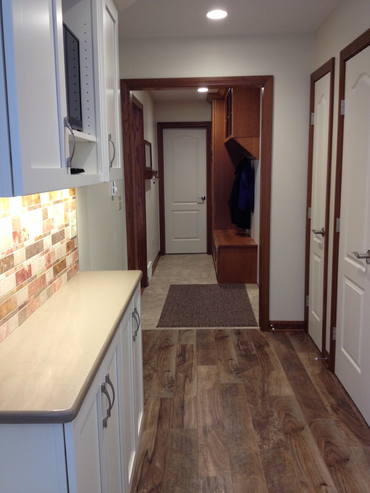 Mudroom - small transitional mudroom idea with beige walls