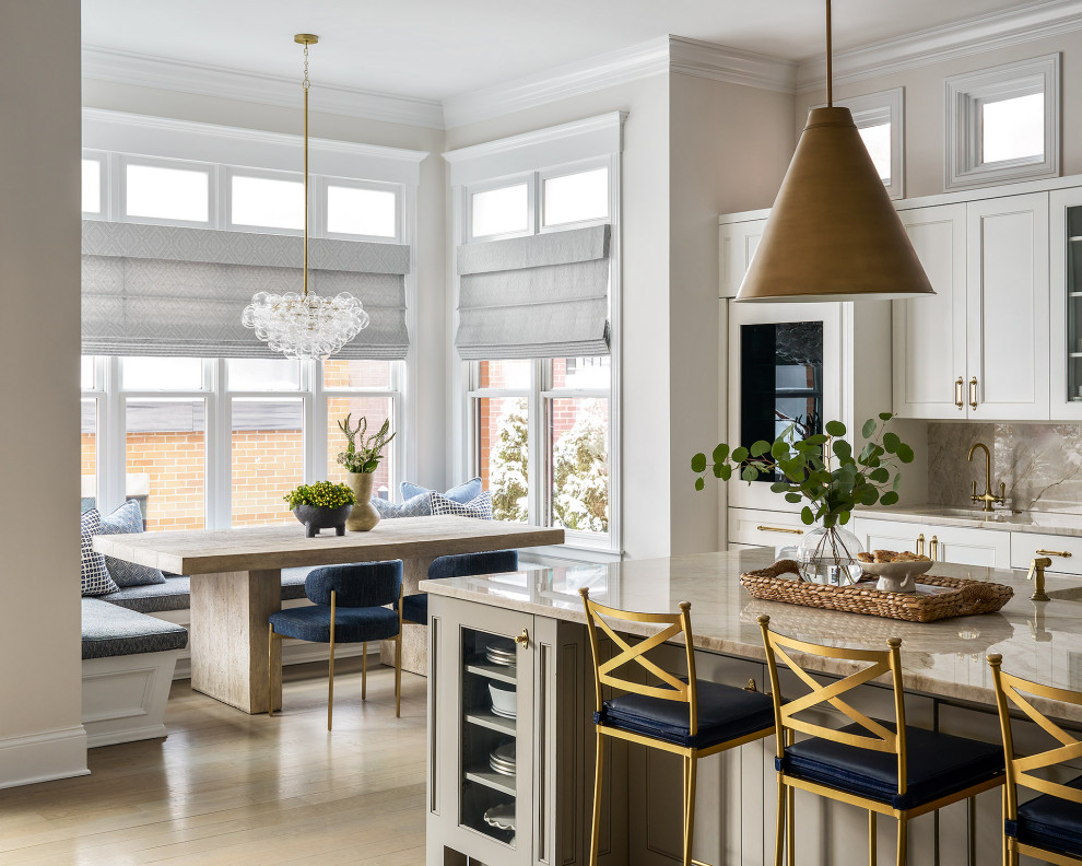 Kitchen - large transitional light wood floor kitchen idea in Chicago with quartzite countertops, stone slab backsplash and an island