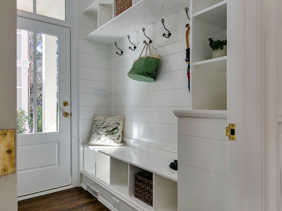 Design ideas for a transitional mudroom in Raleigh with white walls, medium hardwood floors, a single front door, a glass front door and brown floor.