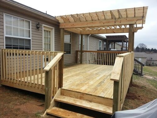 Inspiration for a small arts and crafts backyard deck in Other with a pergola.